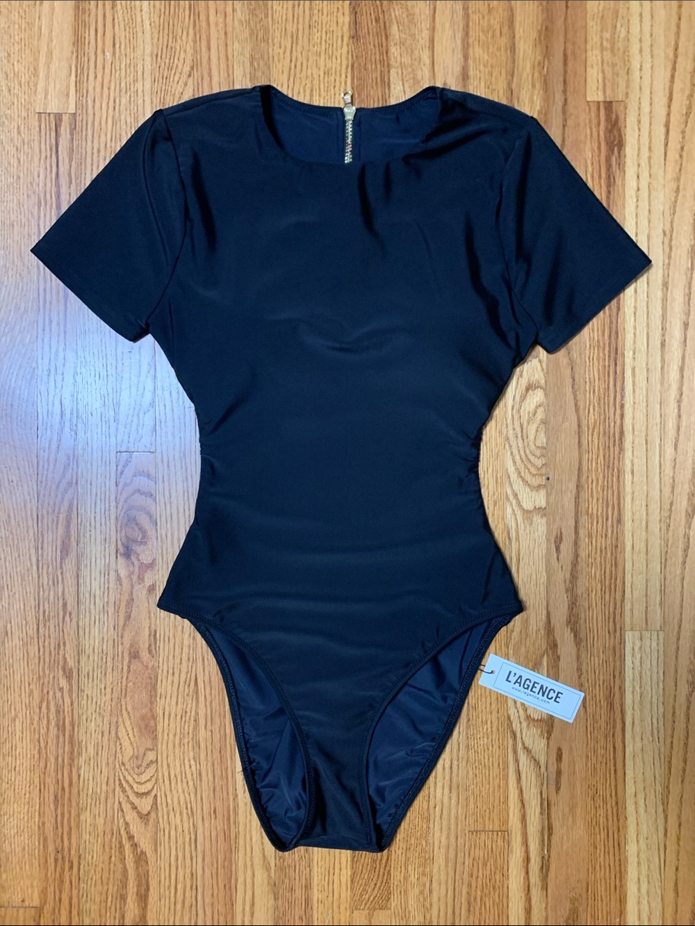 L’AGENCE swimsuit - Akola black one piece short sleeve paddlesuit w cutout back